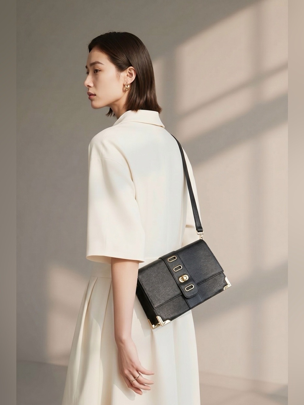 New (WOTs) Black patent leather purse by Poppie with stylish gold accents.